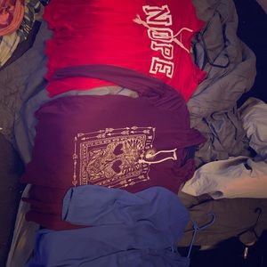 Multiple clothes and shoes and a bling belt